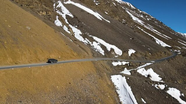 aerial following off road car  driving in Kaza in spiti valley in himalays India mountains landscape 