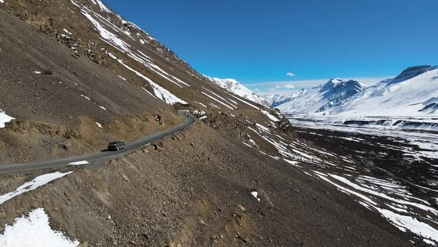 drone following off road jeep 4x4 car driving in world's highest village hikkim in spiti valley in himachal pradesh India 