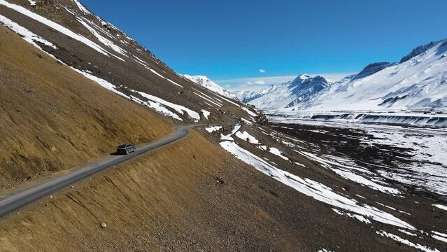 drone following jeep off road car driving in Kaza in spiti valley in himalays india asia exploring travel destination 