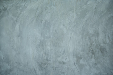 Texture of gray concrete wall with scratches and cracks. Abstract background.
