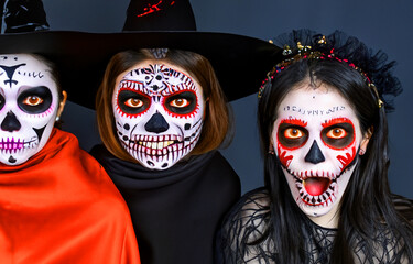 Three scary skeleton faced women