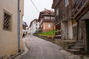 Fototapeta na wymiar A street in the mountain village of Forni Avoltri in Carnia in Udine Province, Friuli-Venezia Giulia, north east Italy