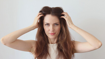 Beautiful woman gives head and hair massage to improve blood circulation, hair growth