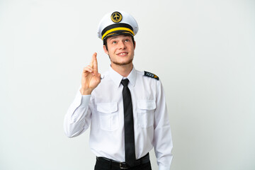 Airplane Russian pilot isolated on white background with fingers crossing and wishing the best
