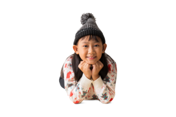 Portrait of attractive cheerful Asian little girl looking lie down on floor festal Christmas day December winter, full body, isolated on white and transparent background