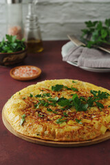 Frittata, traditional egg and potato omelette, Italian dish