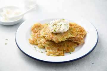 Homemade potato latkes with cream cheese