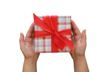 Gift box with a red bow and female hands on transparent background, top view