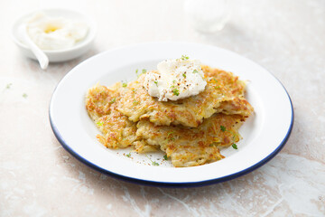 Homemade potato latkes with cream cheese