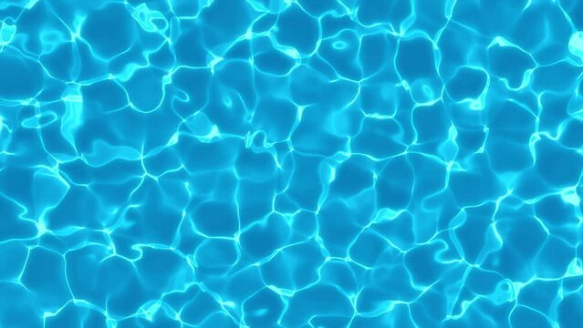 Water surface in a swimming pool, with reflections of sunlight and caustics