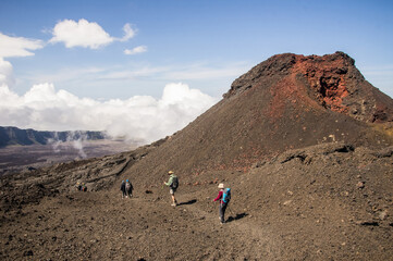 Trekking on the Piton de la Fournaise volcano on the tropical Reunion Island in the Indian Ocean