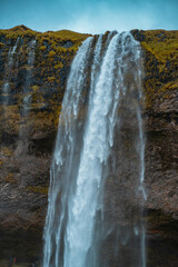 Kvernufoss a 30-meters high waterfall accessible via a rugged hiking trail in Iceland
