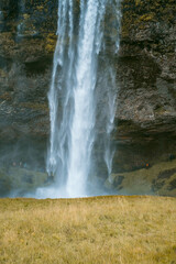 Fototapeta na wymiar Kvernufoss a 30-meters high waterfall accessible via a rugged hiking trail in Iceland