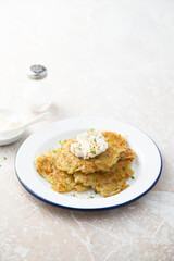Homemade potato latkes with cream cheese