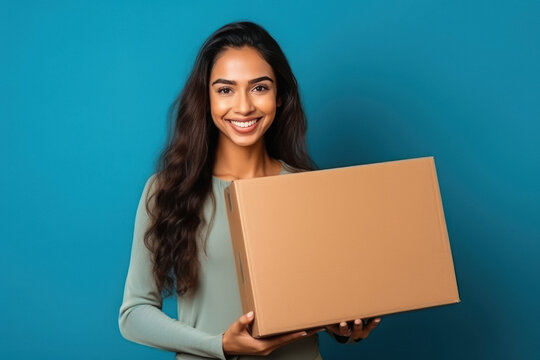 Young Woman Holding Box In Hand And Giving Happy Expression