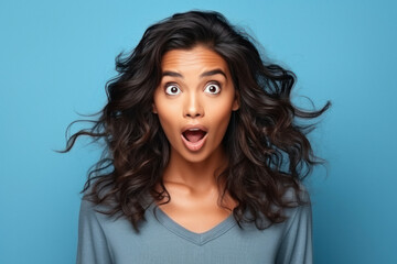 Young woman with short hair she is mouth open then after giving shocking expression