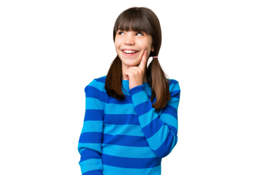 Little caucasian girl over isolated background thinking an idea while looking up