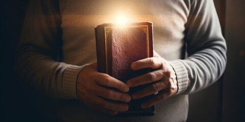 Man is holding and hugging the bible on his chest with atmosphere light from a window representing a symbol of hope and salvation from the Lord. The concept for faith, spirituality, and, Generative AI