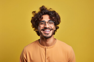 Young indian man wearing spectacles and smiling