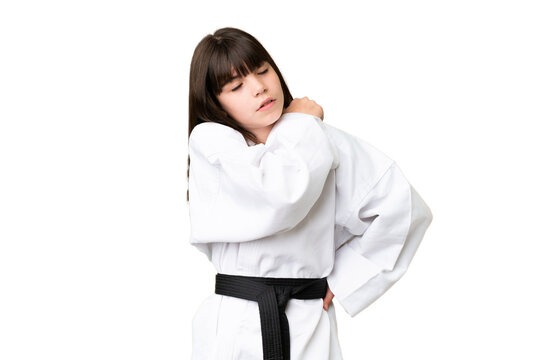 Little Caucasian girl doing karate over isolated background suffering from pain in shoulder for having made an effort