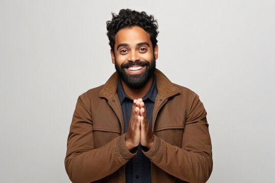 Indian man doing namaste or welcome gesture