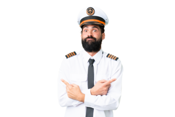 Airplane caucasian pilot man over isolated chroma key background pointing to the laterals having doubts