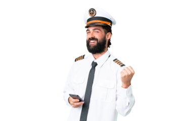 Airplane caucasian pilot man over isolated chroma key background with phone in victory position