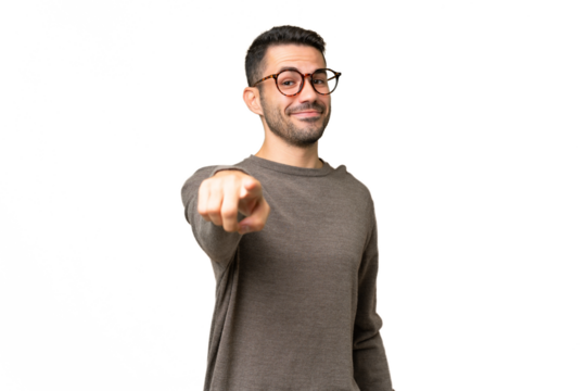 Young handsome caucasian man over isolated background pointing front with happy expression