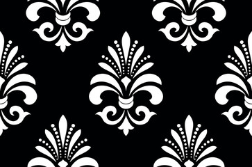 Fototapeta premium Wallpaper in the style of Baroque. Seamless vector background. White and black floral ornament. Graphic pattern for fabric, wallpaper, packaging. Ornate Damask flower ornament