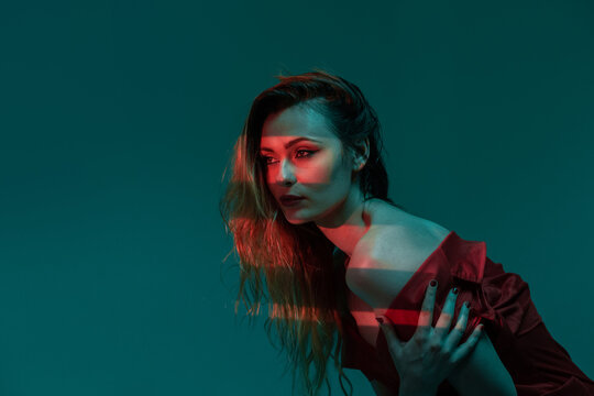 Sensual woman with red lips in studio