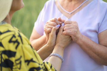 two elderly women continue to hold hands, reminding us that the journey through life s seasons is...