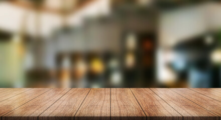 Empty wooden table top with lights bokeh on blur restaurant background