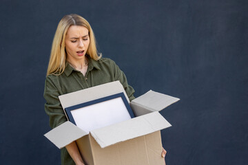 Smiling young woman preparing for relocation