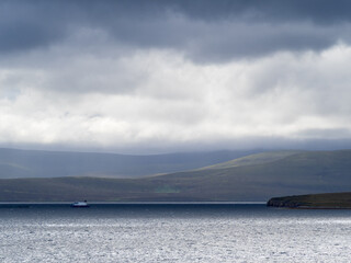 View across Scapa Flow, Mainland, Orkney towards the isle of Hoy with dramatic clouds and lighting