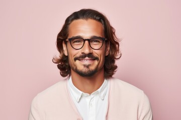 Portrait of handsome young man in eyeglasses smiling at camera