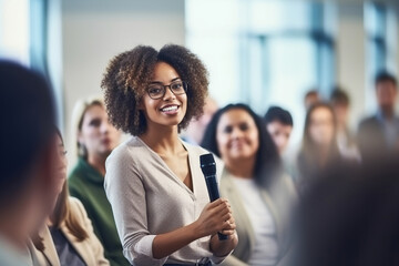 Workshop, speech and black woman or speaker speaking with coworkers in conference room