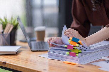 Business Documents, Auditor businesswoman checking searching document legal prepare paperwork or report for analysis TAX time,accountant Documents data contract partner deal in workplace office