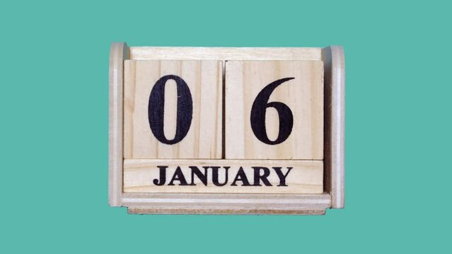木製のカレンダーで1月1日から1月31日までをコマ撮りしたグリーンバックの動画