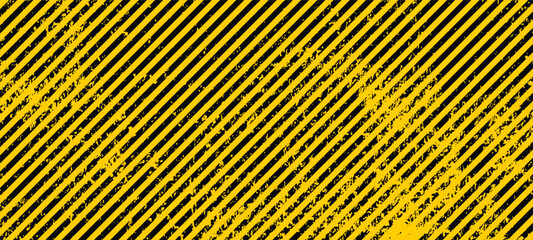 Grunge yellow and black diagonal stripes. Industrial warning background, warn caution, construction, safety