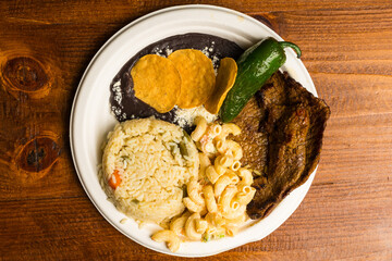 Grilled skirt steak with pasta and rice