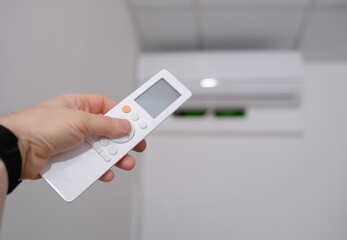 Person manual air conditioner with remote control. Climate control indoor concept
