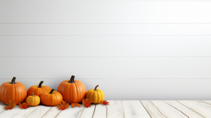 Halloween pumpkins and autumn leaves on white wooden background with copy space