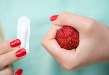 Inflamed external and internal hemorrhoidal nodes and rectal suppositories closeup. Hemorrhoid treatment concept