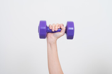 Asian woman wearing black workout clothes with smiling face Exercising with purple dumbbells with cheerfulness against a white background or isolated