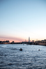 Fototapeta premium The embankment of a beautiful wide river in a large ancient city.