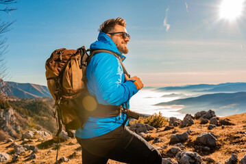 A male hiker backpacker trail hiking in the mountains adventure travel.