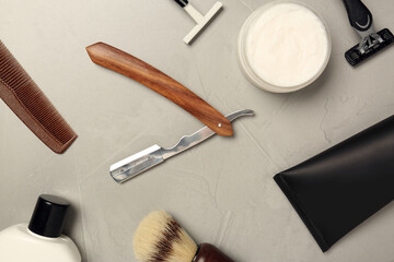 Set of men's shaving tools on light gray table, flat lay