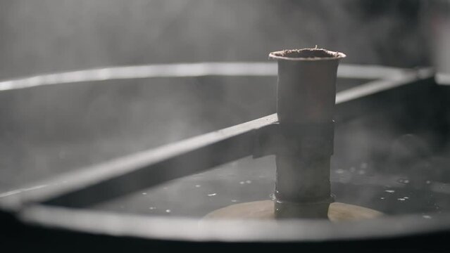 Homemade brandy making. Steam coming out of fermentation tank in distillery, slow motion