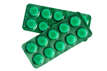 Pills or tablets in green blister pack isolated on transparent background, healthcare and medicine concept, top view