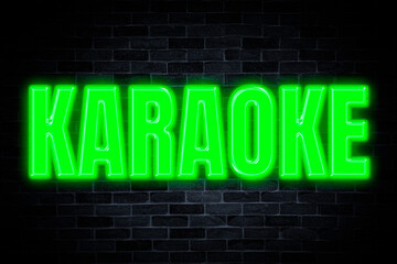 Obraz premium Karaoke neon banner on brick wall background.